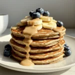 Fluffy high protein banana pancake stack with almond butter