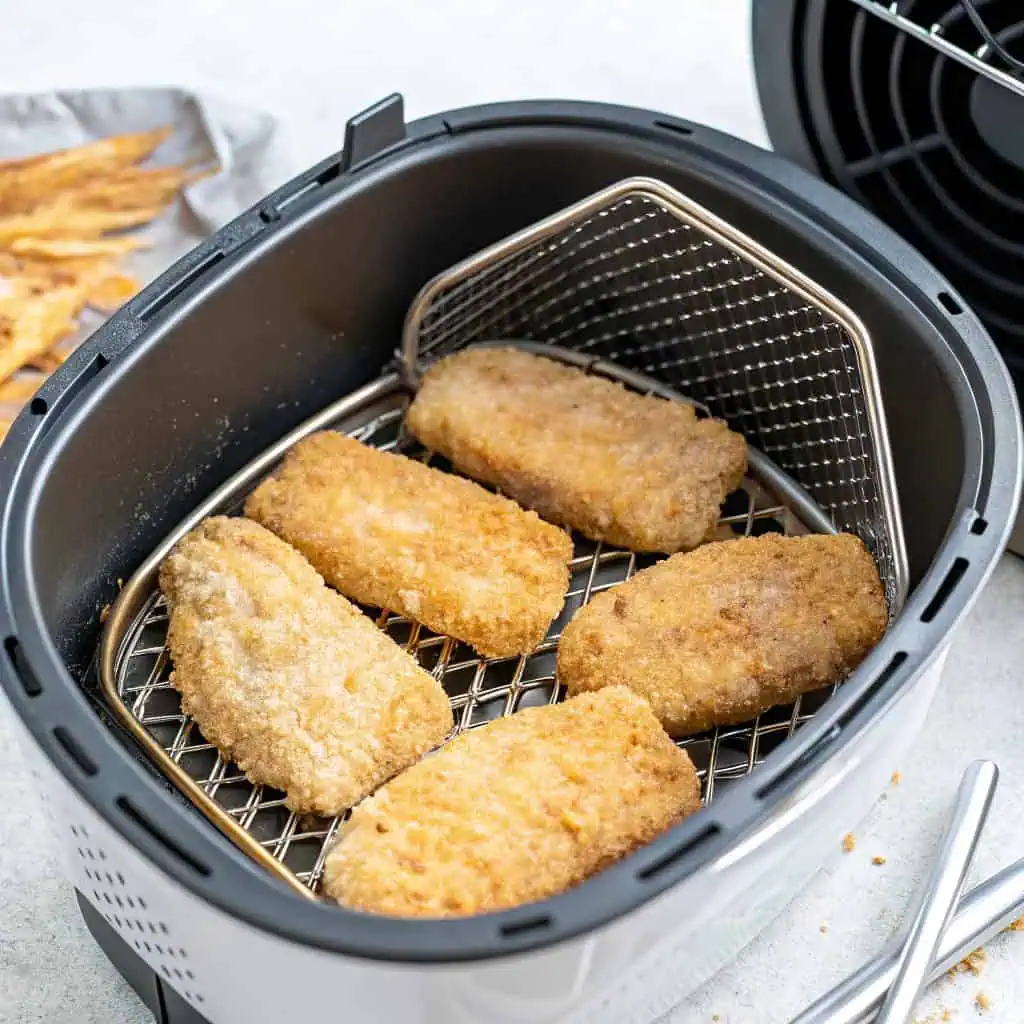 preparing frozen breaded fish in air fryer basket