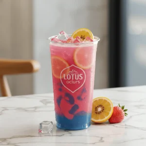 iced lotus drink with fruit slices in clear glass