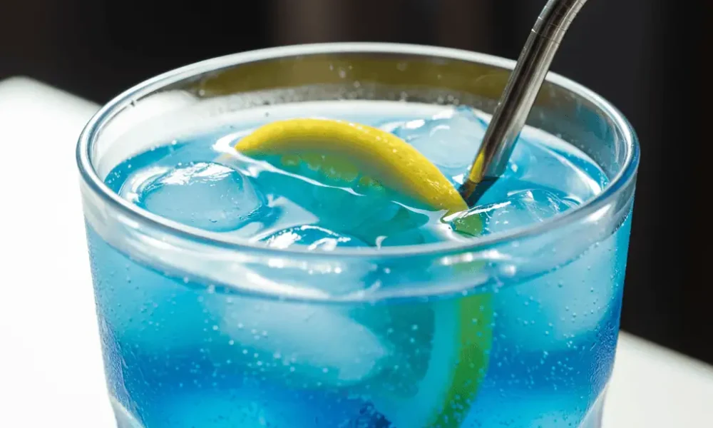Blue lotus energy drink with ice and lemon