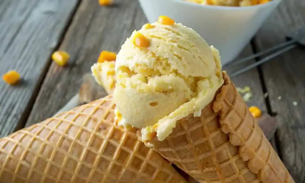 Creamy corn ice cream in waffle cone close-up